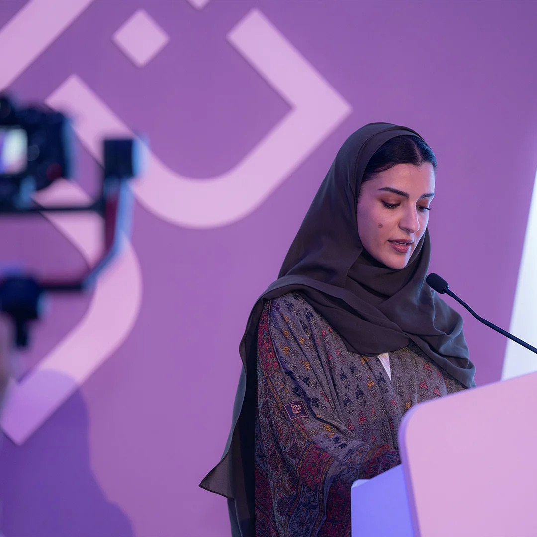 A speaker at the podium during the closing ceremony